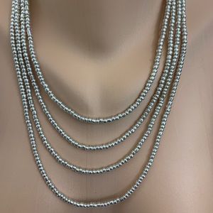 Silver tone beads four strand necklace